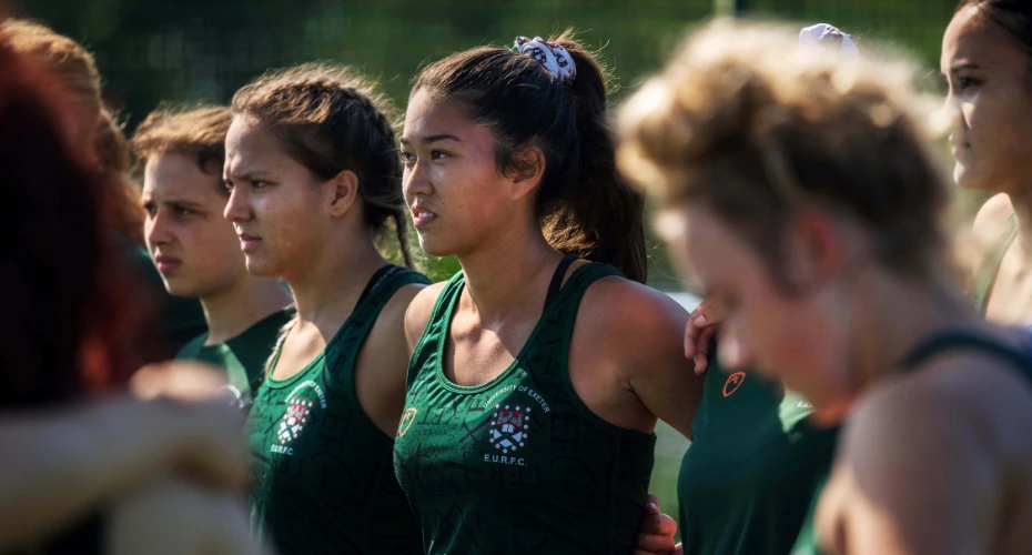 EURFC Rugby players standing in a huddle.