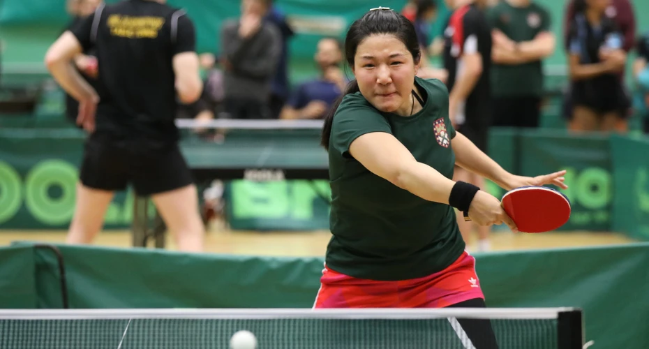 A person playing table tennis.