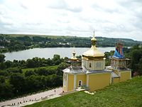 Перебудована замкова церква на тлі річки Горинь