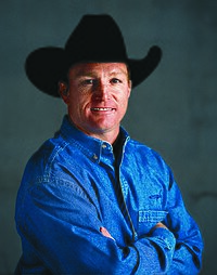 man in black cowboy hat and blue denim shirt