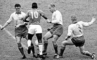 Pelé (number 10) dey dribble past three Swedish players for de 1958 World Cup.