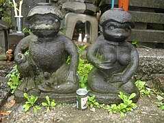 Paired male and female kappa statues at the Sogenji Buddhist shrine at the Asakusa district in Tokyo