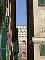 A glimpse among the narrow buildings of the historic center. Note the presence of louvers, a type of frame that is very common in Liguria.