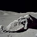 Schmitt stands next to a large boulder during EVA 3.