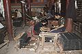 People printing books inside the monastic print house in 2009 (photograph Mario Biondi). More than a hundred workers manually print secular and religious books from hand-cut woodblocks.[11]