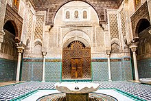 Interior facade of Al-Attarine Madrasa, showing ornate decoration