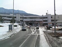 Mainline toll plaza ahead of tunnel portal and administrative building