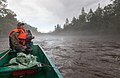 Егерь нацпарка за рулём лодки