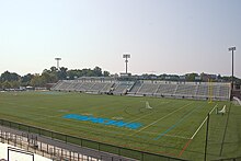 Photo of an empty Homewood Field set up for lacrosse, taken from the top row of one of the end sections