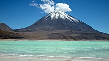 Licancabur, against a blue sky across the Laguna Verde salt lake