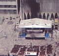 One of the last known photographs of the original memorial, seen below the Marriott Hotel on the left, during the September 11 attacks.