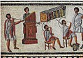 Musicians playing a Roman tuba, a water organ (hydraulis), and a pair of cornua, detail from the Zliten mosaic, 2nd century AD