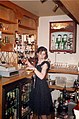 A student working as a barmaid in the UK.