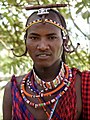 A Kenyan man wearing tribal bead necklaces.