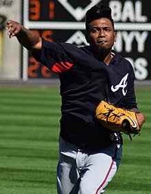 A man in a navy shirt and gray pants