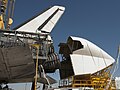 The tail cone being attached to Space Shuttle Discovery