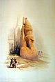 Uno dei due colossi di Ramses II all'ingresso, allora insabbiato, del Tempio di Luxor in un acquerello di David Roberts (1838).