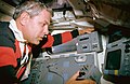 Mission Specialist Parker manually points ASTRO-1's instruments using a toggle on the aft flight deck.