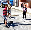 Image 18Plaquita, a Dominican street version of cricket. The Dominican Republic was first introduced to cricket through mid-18th century British contact, but switched to baseball after the 1916 American occupation. (from Culture of Latin America)