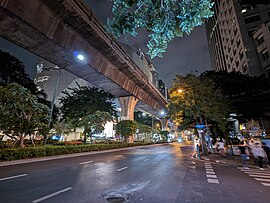 Phloen Chit Road with Sukhumvit Line viaduct above.