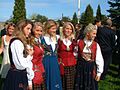 Young girls in different national costumes at Akershus