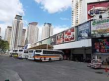 Bus terminal with residential high-rises in the background