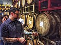 Image 13A beer sommelier tapping a barrel for a taste at Nebraska Brewing Company (from Craft beer)