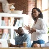 Ambitious african black female employee speaking at diverse meeting