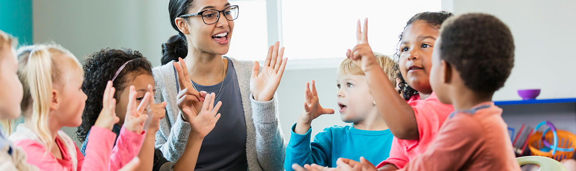 Teacher teaching small children