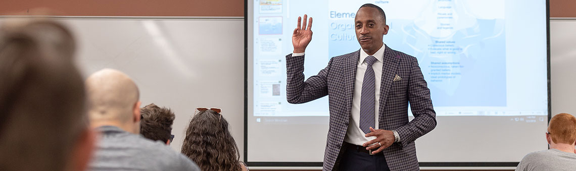 professor at front of classroom