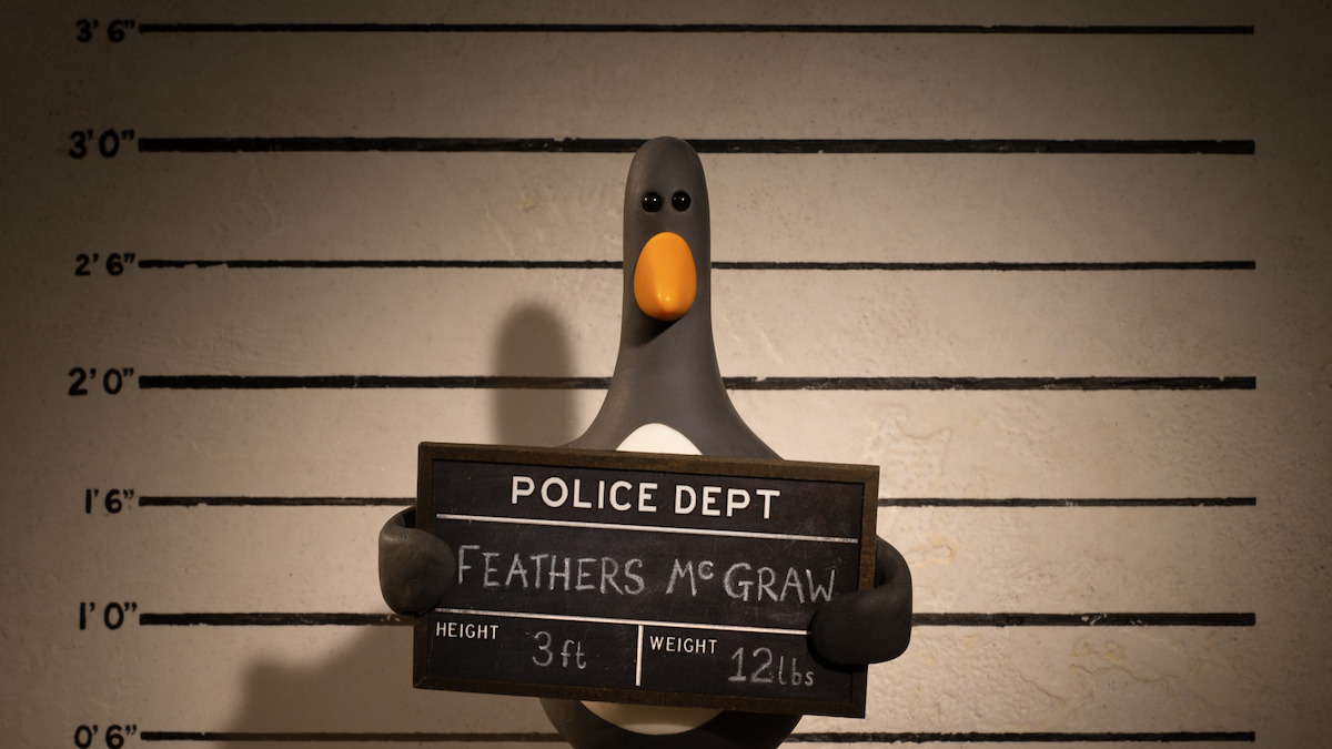 A bird gets his mug shot taken in ‘Wallace & Gromit: Vengeance Most Fowl’