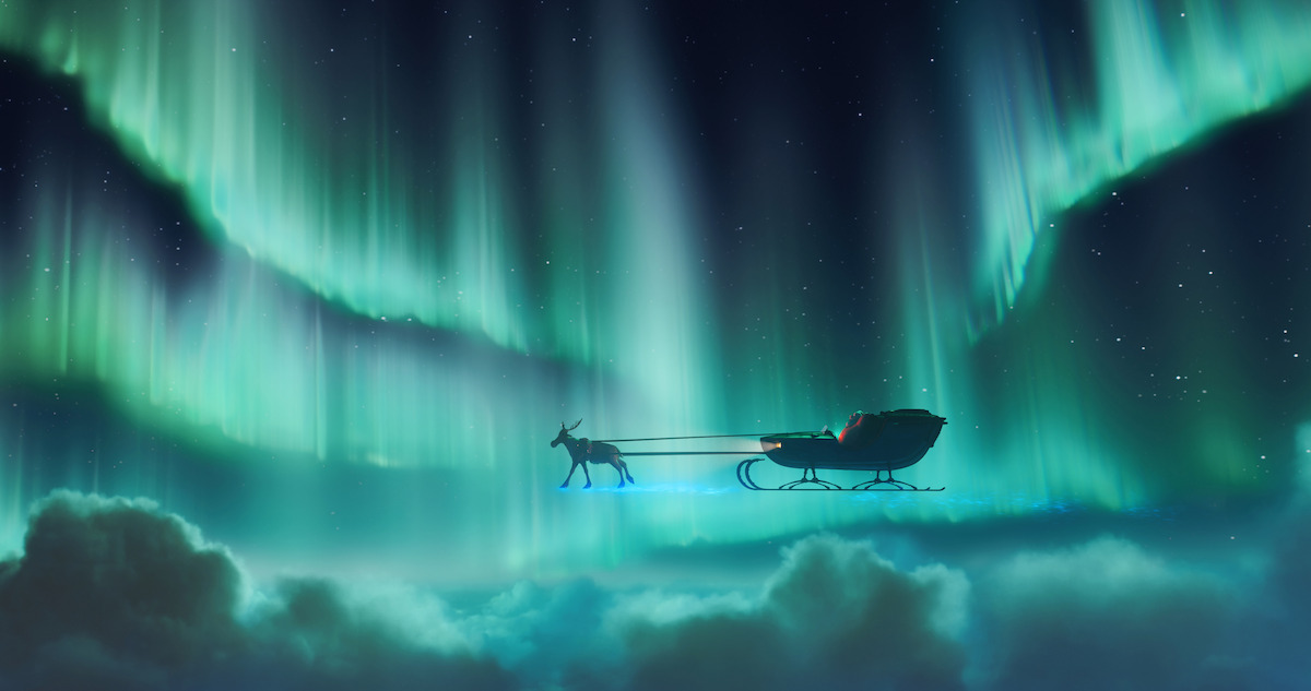 A sleigh flies through the night sky with the northern lights glowing in 'This Christmas'