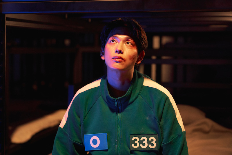 Yim Si-wan as Lee Myung-gi in Squid Game looks up in 'Squid Game' Season 2 