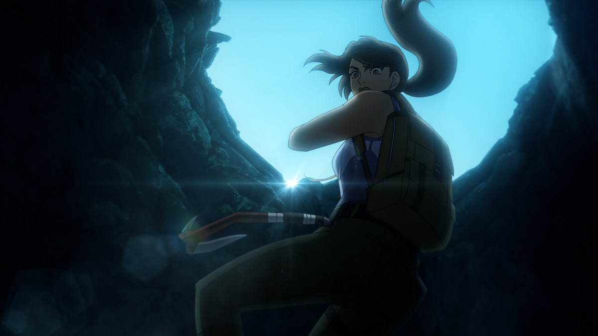 Lara Croft repels into a cave in in 'Tomb Raider: The Legend of Laura Croft'