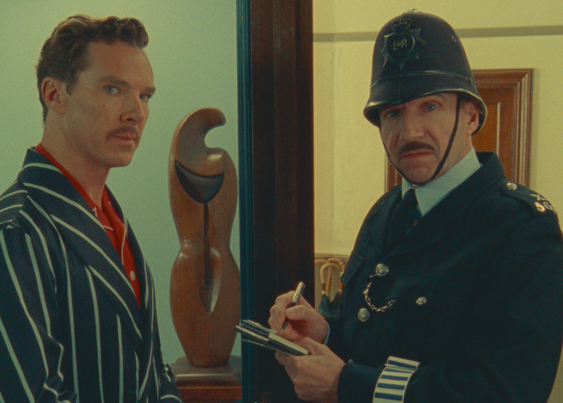 Benedict Cumberbatch as Henry Sugar and Ralph Fiennes as Policeman glance outwards in 'The Wonderful World of Henry Sugar.'