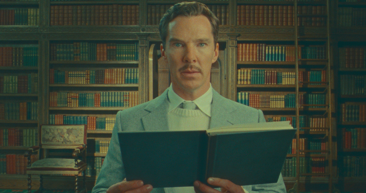 Benedict Cumberbatch holding a book in a still from 'The Wonderful Story of Henry Sugar.'