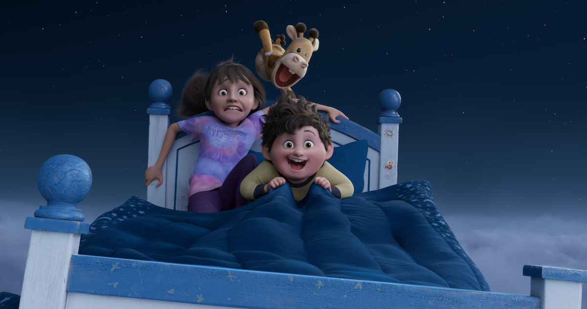 Two kids fly on a bed through the night sky in 'In Your Dreams'