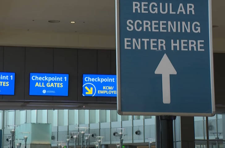 Airport signage directing passengers to security checkpoints