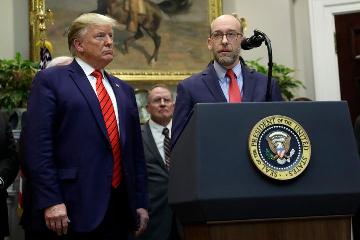 President Donald Trump listens as acting director of the Office of Management and Budget Russ Vought speaks during an event on "transparency in Federal guidance and enforcement" in the Roosevelt Room of the White House, Wednesday, Oct. 9, 2019, in Washington. (AP Photo/Evan Vucci)