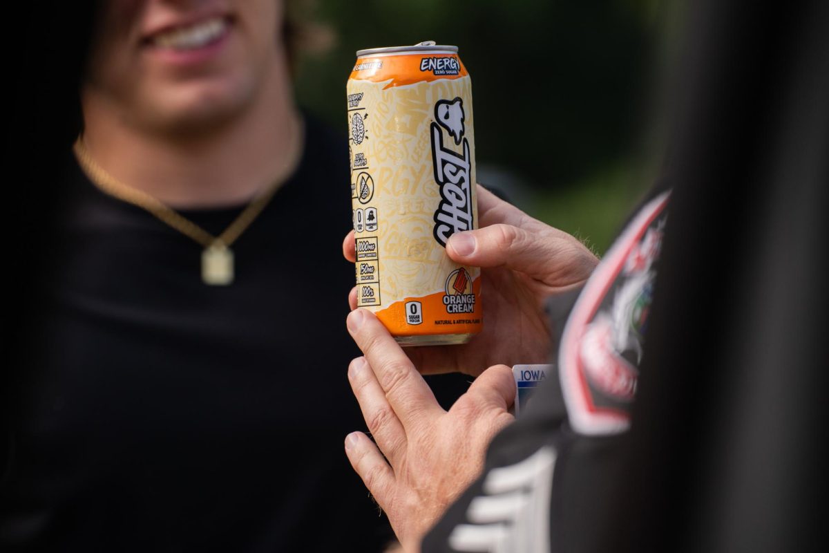 ISUPD Sgt. Justin Gatewood stops a person west of campus to inspect their Ghost energy drink, 801 Day, Aug. 24, 2024, in Ames, Iowa. 