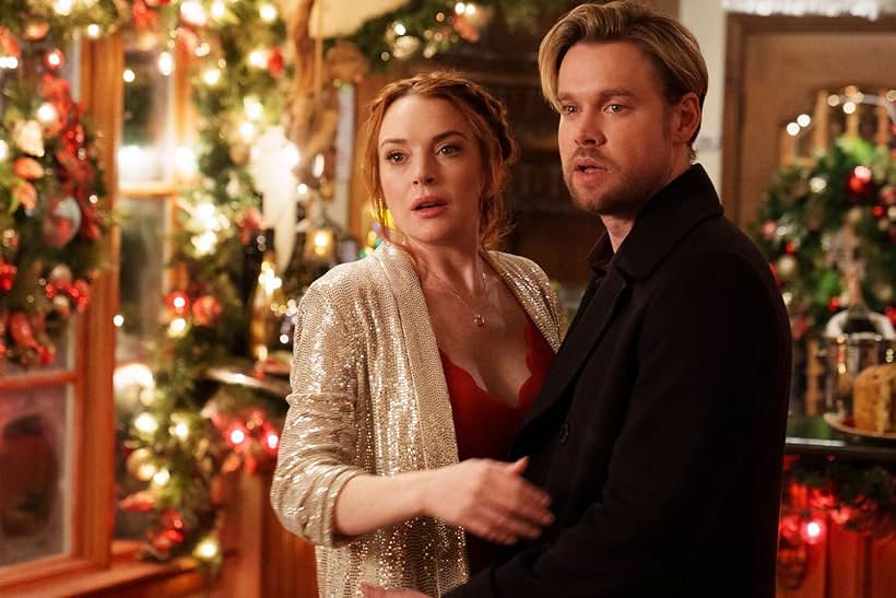 Lindsay Lohan and Chord Overstreet in Falling for Christmas (2022)