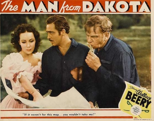 Wallace Beery, Dolores Del Río, and John Howard in The Man from Dakota (1940)