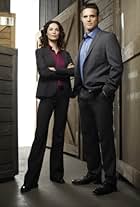 Eddie McClintock and Joanne Kelly in Warehouse 13 (2009)