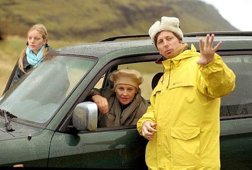 SARAH POLLEY, JULIE CHRISTIE, and director HAL HARTLEY on the set of the satiric fable NO SUCH THING (from United Artists with American Zoetrope). 