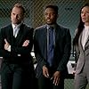 Jonny Lee Miller, Lucy Liu, and Jon Michael Hill in Elementary (2012)