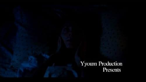 A solitary figure confronts her inner demon in an isolated house in the woods.