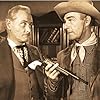 Randolph Scott and George Macready in The Stranger Wore a Gun (1953)