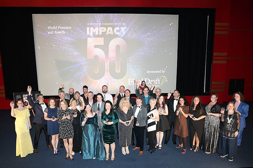 Some of the screenwriters of 'The Impact' celebrating breaking the world record for most screenwriters on a feature film.