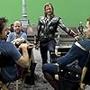 Robert Downey Jr., Chris Evans, Joss Whedon, and Chris Hemsworth in The Avengers (2012)