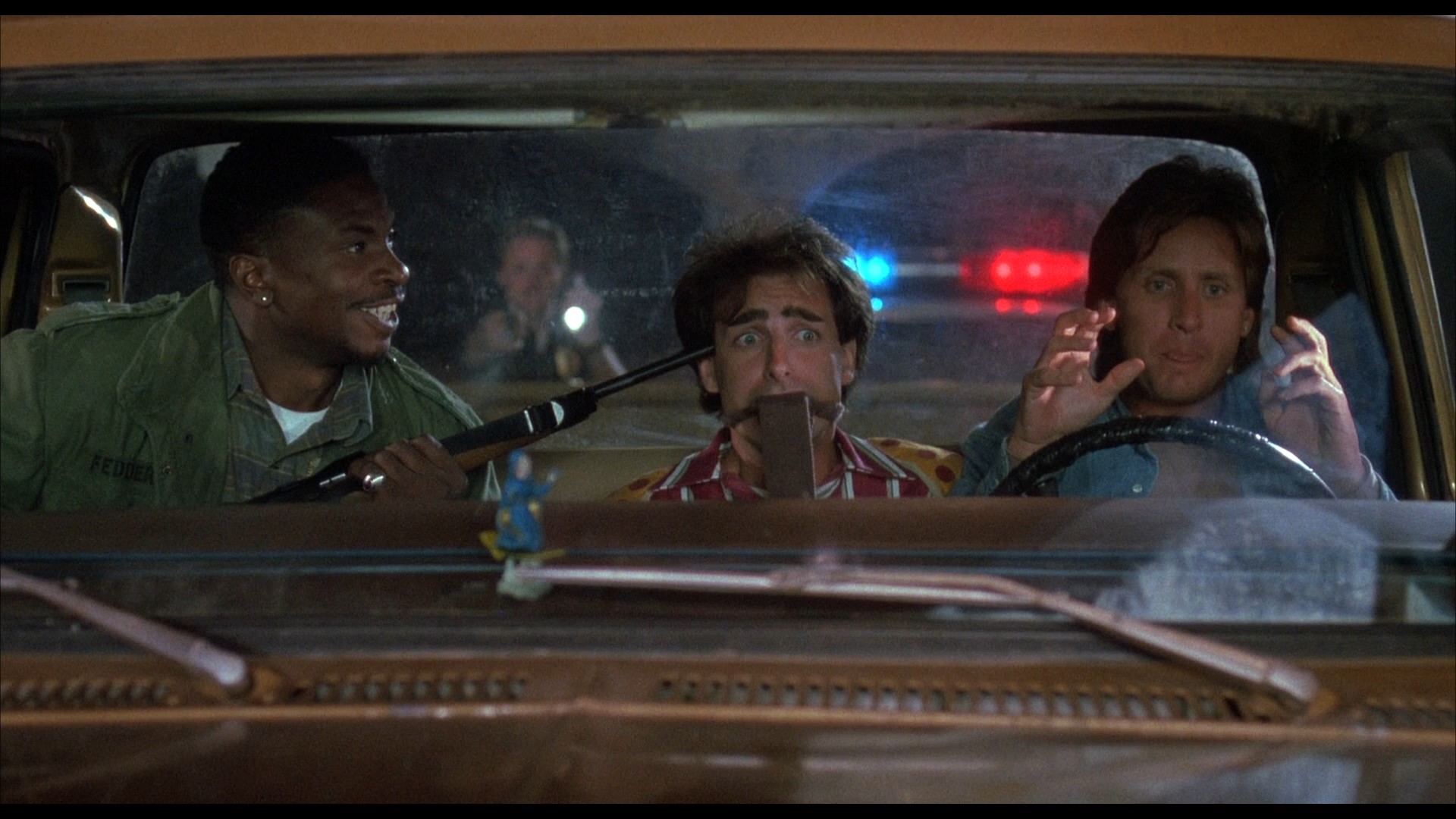 Emilio Estevez, Dean Cameron, and Keith David in Men at Work (1990)